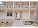 Charming front entrance with lovely columns and a spacious covered porch at 55 N Washington Dr, Sarasota, FL 34236