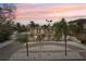 Two-story home exterior features a balcony, driveway and lush landscaping at 55 N Washington Dr, Sarasota, FL 34236