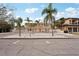 Stunning two-story home with palm trees and a circular driveway at 55 N Washington Dr, Sarasota, FL 34236