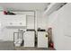 Garage featuring laundry hookups and overhead storage at 55 N Washington Dr, Sarasota, FL 34236