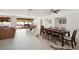 Spacious living area with access to the pool area and multiple dining spaces at 55 N Washington Dr, Sarasota, FL 34236