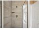 Standing shower featuring modern gray tile and an adjustable shower head at 55 N Washington Dr, Sarasota, FL 34236
