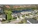 An aerial view of the houses that make up the community, highlighting nearby lake and landscaping at 6161 Anise Dr, Sarasota, FL 34238