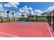 Brightly colored basketball court with manicured landscaping offers residents recreation and a pleasant view at 6161 Anise Dr, Sarasota, FL 34238