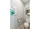 Powder room offering accessibility features with a grab bar and organized storage for added convenience at 6161 Anise Dr, Sarasota, FL 34238