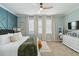 Serene bedroom featuring neutral tones, ample natural light, and a cozy, well-designed layout at 6161 Anise Dr, Sarasota, FL 34238