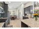 Open kitchen with stainless steel appliances, granite countertops, and a view to the dining area at 6161 Anise Dr, Sarasota, FL 34238