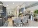 Open kitchen with seating at the island, pendant lighting and stainless steel appliances at 6161 Anise Dr, Sarasota, FL 34238