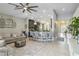 Open floorplan with kitchen island, living room with sofa, and natural light at 6161 Anise Dr, Sarasota, FL 34238