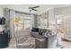 Comfortable seating area with neutral tones, a large window, and tiled floors at 6161 Anise Dr, Sarasota, FL 34238