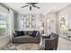 Cozy living room with a sofa, accent chair, and decorative window that is great for Gathering photos at 6161 Anise Dr, Sarasota, FL 34238