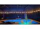 An inviting screened pool area is ready for night swims with tranquil lighting and comfortable seating at 6161 Anise Dr, Sarasota, FL 34238