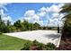 A sand volleyball court surrounded by lush greenery provides a fun recreational amenity at 6161 Anise Dr, Sarasota, FL 34238