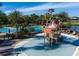 Community water park with a splash pad, slides, and a large swimming pool, perfect for Gathering fun at 6161 Anise Dr, Sarasota, FL 34238