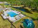 Beautiful community pool and playground area with a tranquil pond view at 6306 115Th E Ave, Parrish, FL 34219