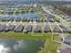 Aerial view of a home near a lake in a residential community showcasing the property's location at 6306 115Th E Ave, Parrish, FL 34219