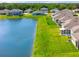 Stunning aerial view featuring a lakefront property and neighboring homes at 6306 115Th E Ave, Parrish, FL 34219