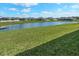 Beautiful backyard with a serene pond view, perfect for relaxation and enjoying nature at 6306 115Th E Ave, Parrish, FL 34219