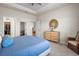 Spacious bedroom boasts neutral decor, tray ceiling, and convenient access to a walk-in closet at 6306 115Th E Ave, Parrish, FL 34219