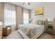 Comfortable bedroom featuring neutral tones, stylish décor, and a decorative floral bedspread at 6306 115Th E Ave, Parrish, FL 34219