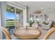 Cozy dining area with sliding glass doors to patio and view of backyard at 6306 115Th E Ave, Parrish, FL 34219