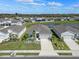 Well-maintained home exterior featuring lush landscaping, a two-car garage, and a charming entrance at 6306 115Th E Ave, Parrish, FL 34219