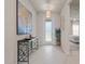 Inviting foyer featuring stylish decor, tile flooring, and a decorative front door at 6306 115Th E Ave, Parrish, FL 34219