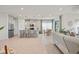 Bright open-concept kitchen features stainless appliances, an island with seating, and a cozy breakfast nook at 6306 115Th E Ave, Parrish, FL 34219