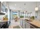 Open-concept kitchen featuring granite countertops, stainless appliances and eat-in dining area at 6306 115Th E Ave, Parrish, FL 34219