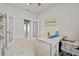 Well-lit home office features French doors, neutral decor, and a relaxing ambiance at 6306 115Th E Ave, Parrish, FL 34219