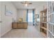 Bright home office space featuring an ocean art piece and ample shelving at 6306 115Th E Ave, Parrish, FL 34219