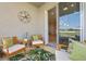 Screened lanai with comfortable seating and view to the interior of the home at 6306 115Th E Ave, Parrish, FL 34219