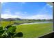 Backyard view features serene water and lush green lawns at 6306 115Th E Ave, Parrish, FL 34219