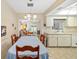 The dining room is adjacent to the kitchen and living room at 6320 Tilly St, Englewood, FL 34224