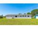 Expansive backyard features a large grassy area and a single-story home at 6349 5Th Street E Cir, Bradenton, FL 34203