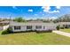 Charming single-story home with a well-manicured lawn and an attached one-car garage at 6349 5Th Street E Cir, Bradenton, FL 34203