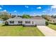Charming single-story home with a well-manicured lawn and an attached one-car garage at 6349 5Th Street E Cir, Bradenton, FL 34203