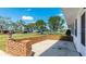 Charming front patio features decorative brickwork and plenty of room for outdoor seating at 6349 5Th Street E Cir, Bradenton, FL 34203