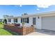 Cozy front patio features brick accents and space to relax at 6349 5Th Street E Cir, Bradenton, FL 34203