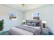 Comfortable main bedroom features plush carpets, neutral walls, two windows and matching bedside lamps at 6349 5Th Street E Cir, Bradenton, FL 34203