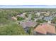 Aerial view of the neighborhood showcasing mature trees, well-maintained lawns, and tile roofs at 6617 Nautical Dr, Lakewood Ranch, FL 34202