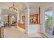 Grand foyer with tile floors, columns, coffered ceiling, and views of the living and dining areas at 6617 Nautical Dr, Lakewood Ranch, FL 34202