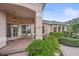 Home exterior featuring a charming covered front porch, front door and meticulous landscaping at 6617 Nautical Dr, Lakewood Ranch, FL 34202