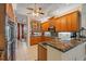 Well-equipped kitchen with stainless steel appliances, granite counters, and custom cabinetry at 6617 Nautical Dr, Lakewood Ranch, FL 34202