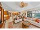 Spacious living area with plush sofas, wooden furniture, and an open layout at 6617 Nautical Dr, Lakewood Ranch, FL 34202