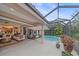 Inviting pool area with connecting indoor and outdoor living spaces through screened lanai at 6617 Nautical Dr, Lakewood Ranch, FL 34202