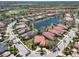 Aerial view of the neighborhood highlighting the ponds, mature trees, and well-maintained streets at 7141 Whitemarsh Cir, Lakewood Ranch, FL 34202