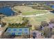 Legacy Golf Club aerial image featuring the golf course, tennis and pickleball courts, and parking areas at 7141 Whitemarsh Cir, Lakewood Ranch, FL 34202
