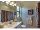 Bathroom with a white vanity, framed mirror, and coordinated towels at 7141 Whitemarsh Cir, Lakewood Ranch, FL 34202
