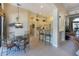 Bright breakfast nook features modern lighting and seamless flow to the kitchen and living spaces, ideal for casual dining at 7141 Whitemarsh Cir, Lakewood Ranch, FL 34202